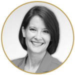 Tanya Tosen smiling professional headshot, black and white, with short dark hair, framed in a gold circle.